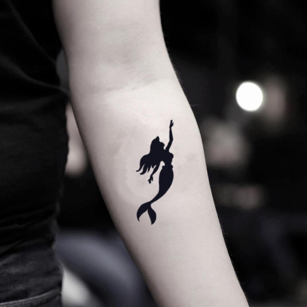 fake small ariel shadow cartoon temporary tattoo sticker design idea on inner arm