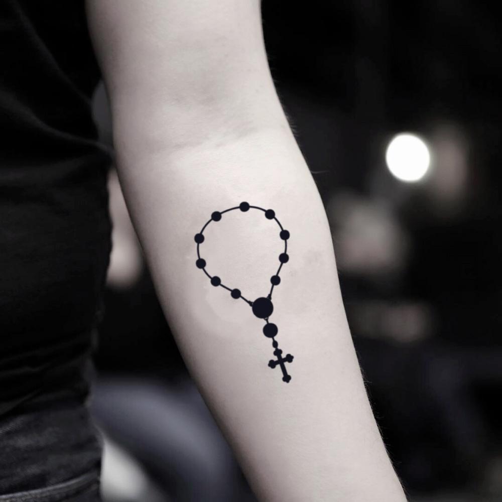 fake small rosary beads cross bracelet necklace illustrative temporary tattoo sticker design idea on inner arm